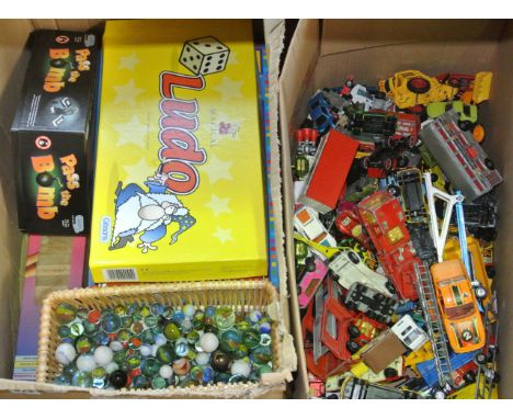 An extensive collection of die cast model vehicles to include Matchbox etc, together with a collection of glass marbles, boar