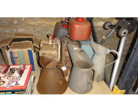 One lot of vintage and later petrol cans, oil jugs and a selection of reference books relating to transport, further books in