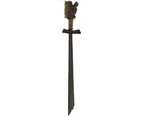 An Indonesian Campilan sword, 64cm edge shaped blade, broadening to the tip and with shaped clipped back tip, carved wooden h