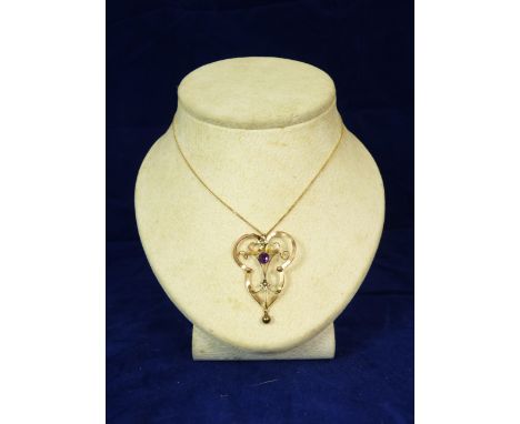 A small 9ct gold amethyst and seed pearl pendant on gold chain together with an openwork gold metal pendant set with amethyst