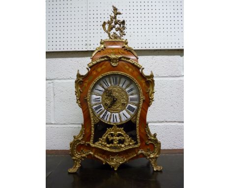 A large French style, reproduction bracket clock.  The case with floral inlay and applied gilt brass decorative mounts, the b