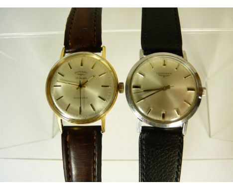 A Gents steel cased "Longines" manual wind wristwatch, matt silver dial with baton numerals and on a calf leather strap, and 