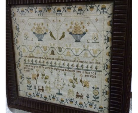 A 19th Century sampler worked in coloured wools with baskets of fruit, animals, flowers and religious text also "Elisabeth La