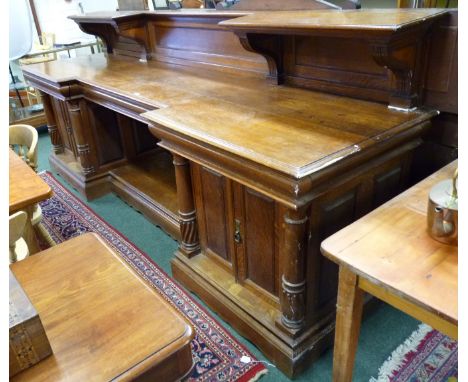 A monumental Victorian oak sideboard, the central narrow drawer stamped "MORANT & CO, 91 NEW BOND ST, LONDON".  The inverted 