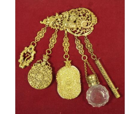 A framed gilt metal Chatelaine buckle scroll pierced and with mythical winged creature, with five pierced suspension loops fi