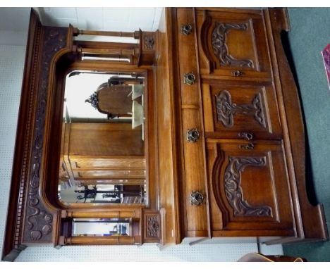 A quality, large oak Art Nouveau sideboard, the base fitted with three cupboards, two with shelf interiors, the other with a 