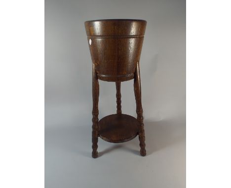 An Edwardian Oak Barrel Shaped Planter on Tripod Support with Stretcher Shelf, 67 cm High