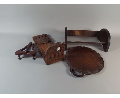 A Carved Indian Book Slide with Elephants Supports, Carved Book Trough and Circular Tray with Carved Handle 
