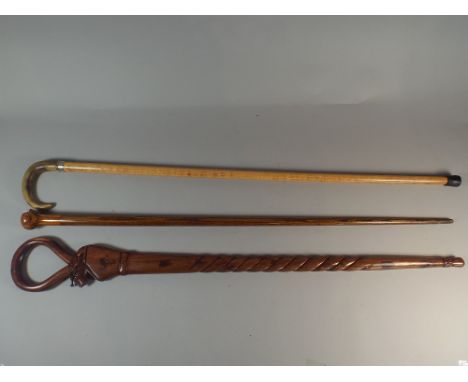 An Inlaid Walking Cane, Horn Handled Walking Stick and A Carved Walking Stick