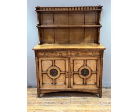 A carved oak dresser in the manner of Bruce James Talbert (1838-1881), last quarter of the 19th century, with galleried top s