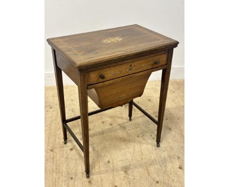 An Edwardian inlaid rosewood games and work table, the rectangular foldover top with ivory and boxwood inlay, opening to a pl