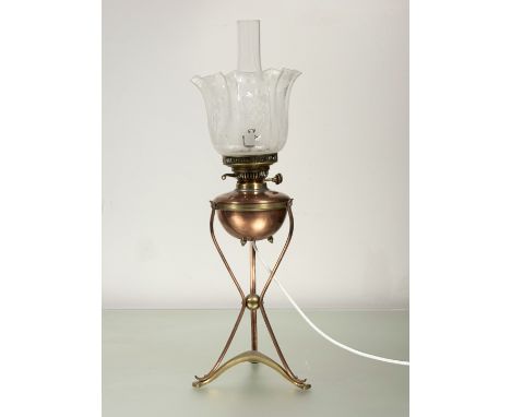 W.A.S. Benson (1854-1924), an Arts & Crafts copper and brass oil lamp, impressed mark to foot, the copper reservoir supported