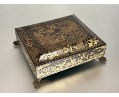 A Chinese Export black and gilt lacquer games or table box, 19th century, of rectangular form, the lift-off caddy top elabora