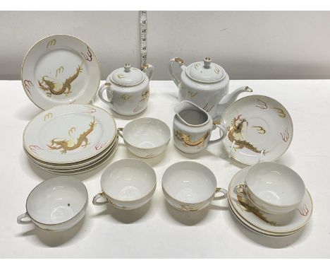 A Japanese egg shell porcelain tea service with Geisha girl to base of cups , (19 pieces in total) shipping unavailable