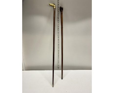 Two vintage wooden walking canes, one with a dogs head brass finial, shipping unavailable