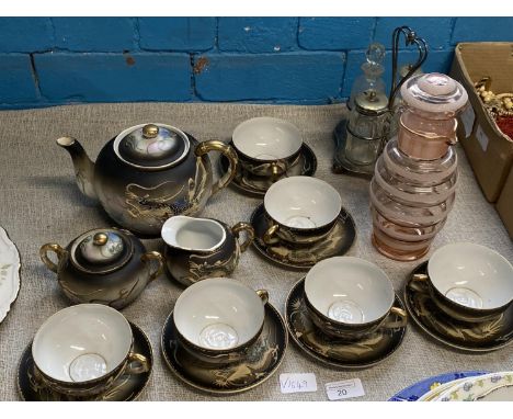 A vintage Japanese egg shell porcelain tea service with Geisha girl to base of cups with a mid-century decanter and cruet set