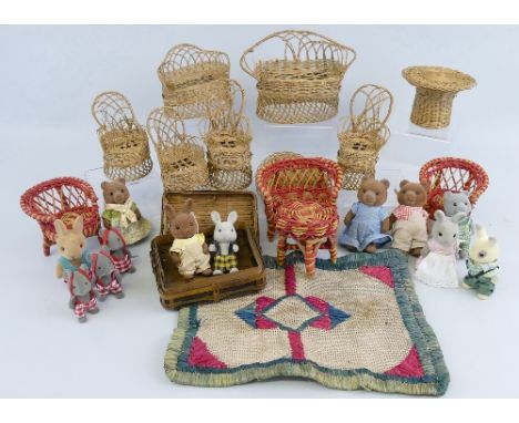 Dolls house furniture, twelve pieces of wicker furniture comprising settees, chairs, table and trunk and twelve miniature dre