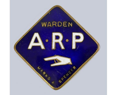 A WWII Marks and Spencer ARP warden badge, of lozenge shaped form in blue and white enamel, marked Simpson and Co London