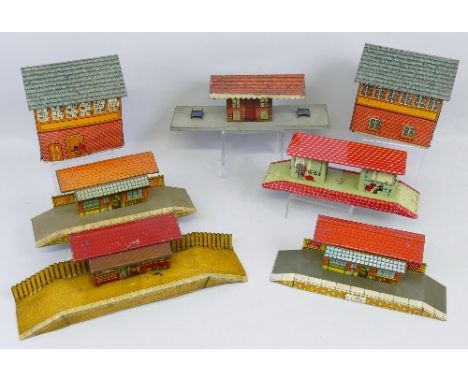 Various makers '0' gauge and '00' gauge, trackside tin-plate buildings comprising Brimtoy signal box, booking office and two 