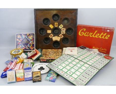 Playing card related items, comprising boxed Carlette board game, oak game board, jigsaw, tins, games, ashtray and various pa