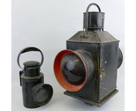 A BR (M) two-sided railway lamp, with black painted steel square section case, two red bullseye lenses and mounting bracket t