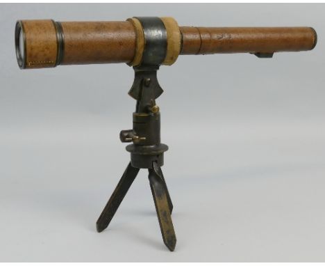 An early 20th century leather covered brass sighting scope, marked F. Davidson and Son London W. Patent No.13251-12 on brass 