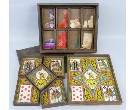 An early 20th century French playing card game, entitled "Nain Jaune", the oblong wooden box with sliding top opening to reve