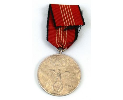 A 1936 Berlin Olympic Games Medal of Merit, silver plated bronze, Olympic Rings & Eagle, orange ribbon, sold with a guarantee