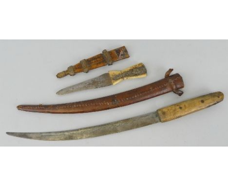 A tribal dagger, with 13cm steel double edged blade and bone waisted grip in bound hardwood scabbard 26cm overall and another