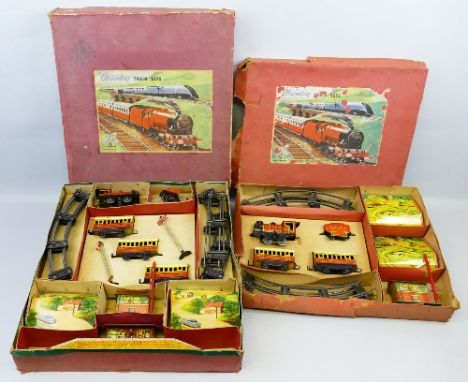 Brimtoy '0' gauge, tin-plate train set with clockwork 0-4-0 locomotive No.416, tender, three passenger coaches, station, sign