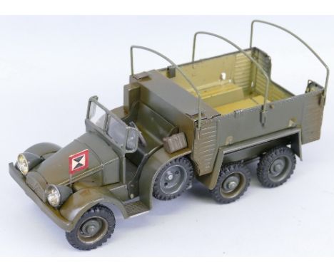 A Lineol tin-plate clockwork model, of a WWII three-axled troop carrying truck, rubber tyres marked Lineol (one spare tyre re