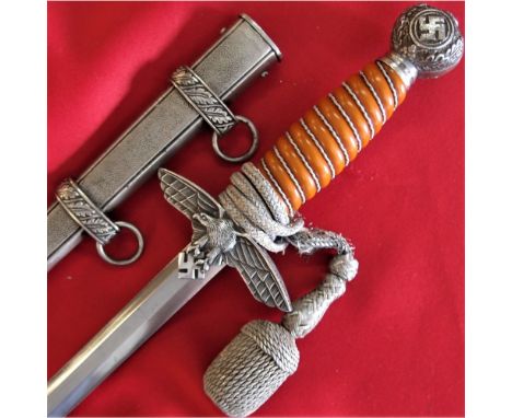 Orange celluloid grip, with full wire wrap, rotating large symbol &amp; oakleaf pommel, with eagle aluminium cross guard. Sil