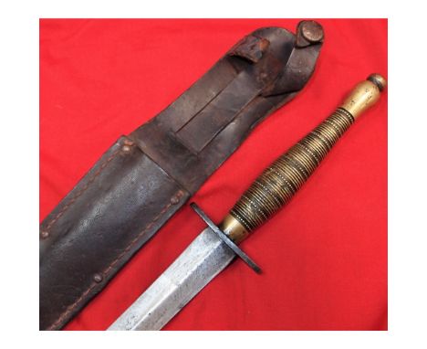 Features a brass grip, with beaded &amp; ribbed guard, showing use and some nicks overall. 15 cm long double edged blade, wit