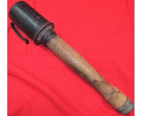 WW1 era Model 1915 German Stick grenade with belt clip. Turned wooden haft, with ink stamped 51/2 Sek. AEB &amp; K23517. Meta