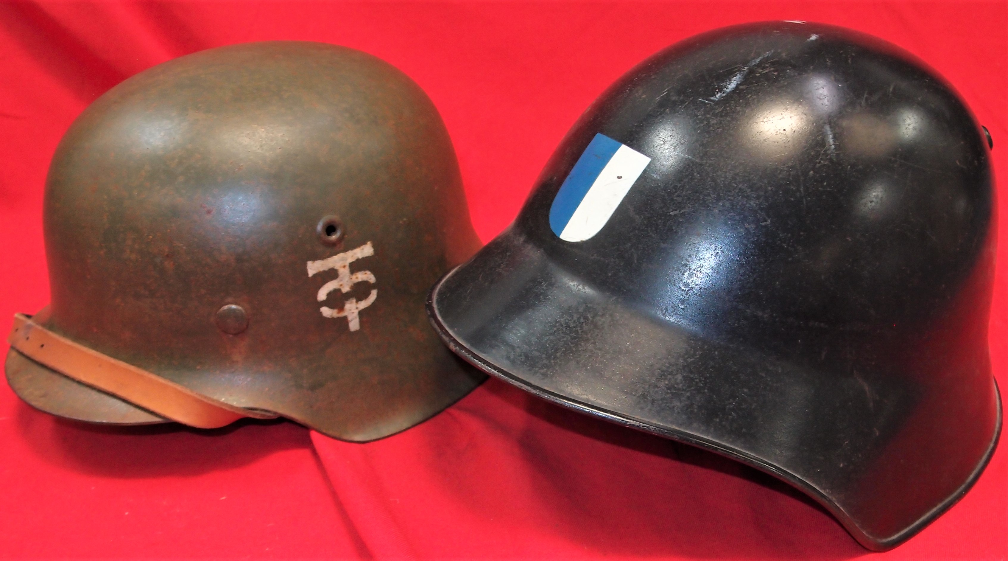 WW2 German M42 & Swiss M18 steel helmets (2). Repainted green finish ...