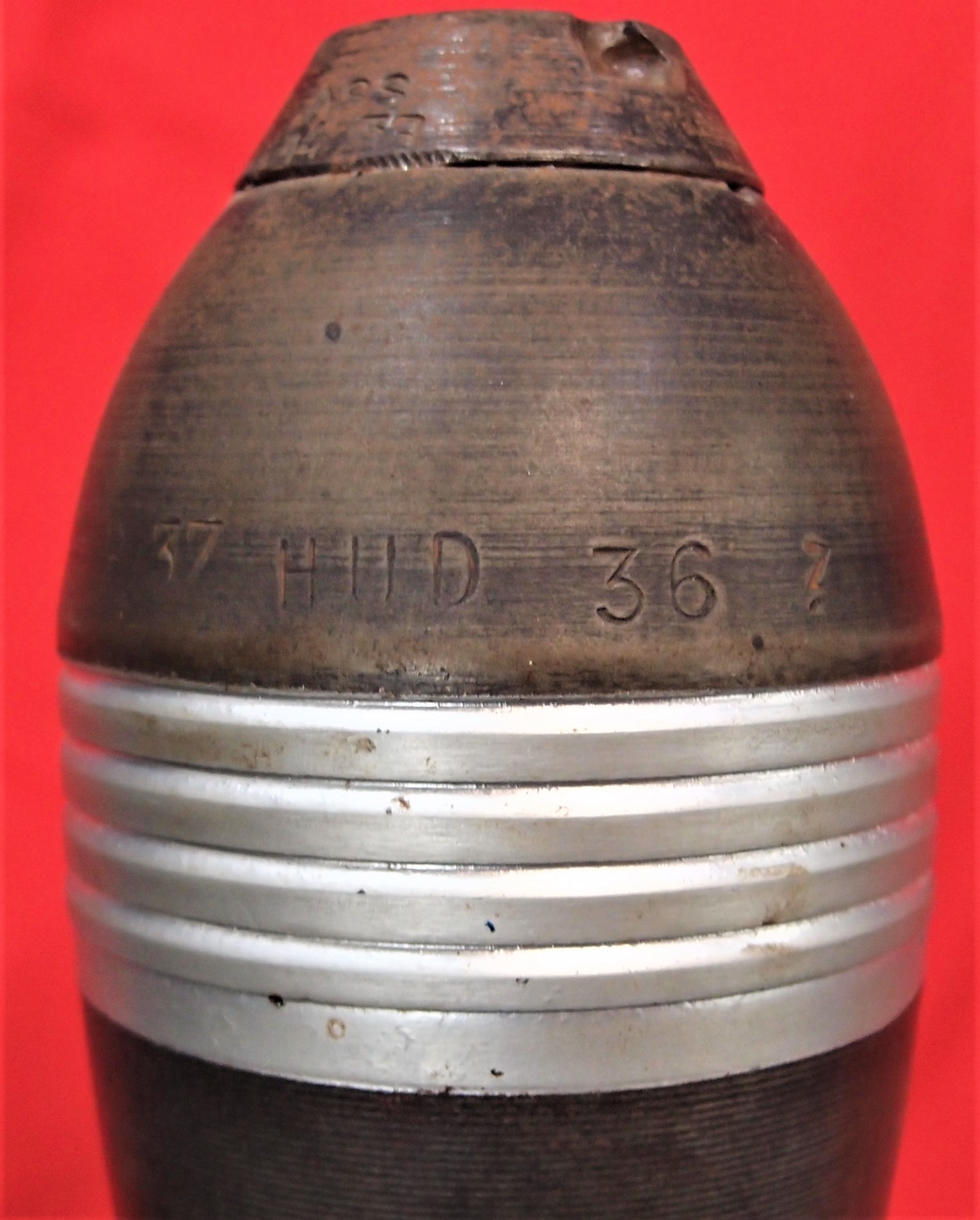 WW2 era 80mm mortar shell. Black & silver finished, with head and fin