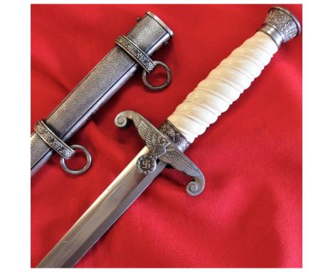 Features fine plated silver nickel fittings overall, with white grip and crisp eagle cross guard. Unmarked 25.5cm long blade 