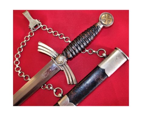 Rotating nickel &amp; brass pommel, with dark blue leather grip, with full wire wrap, showing service wear to grip &amp; miss