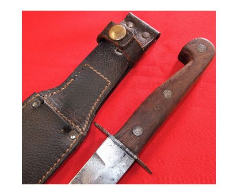 Doves head style rivetted wooden grips, with scratched letters MSM to both sides, with sheet metal guard. 15.4cm long blade, 