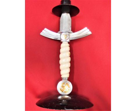 WW2 German dagger candle stick holder. Purported to be a 1st pattern Luftwaffe dagger, with cut down blade, with candle holde