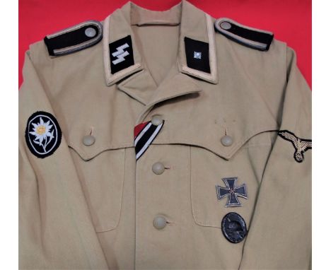 WW2 German SS tropical ‘Sahariana’ uniform jacket. Light-weight tan cotton twill, featuring a vertical, four button front clo