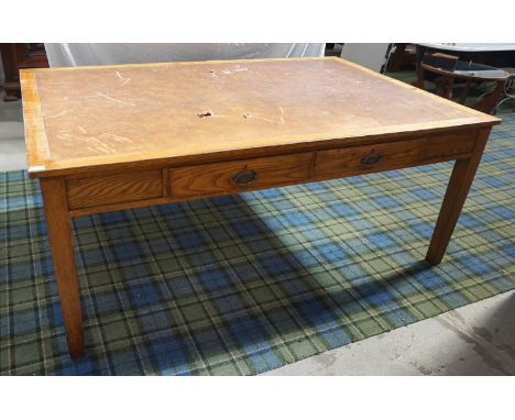 1930s LIGHT OAK DESK
with an inset leather effect top above two frieze drawers, standing on tapering supports, 183cm wide 