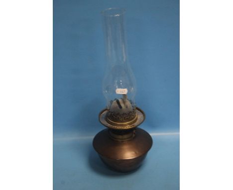 A COPPER PARRAFIN LAMP NO SHADE