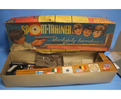 A VINTAGE BOXED SPORT TRAINER, PARTS NOT CHECKED