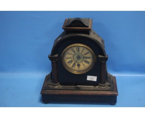AN OAK MANTEL CLOCK WITH PENDULUM NO KEY