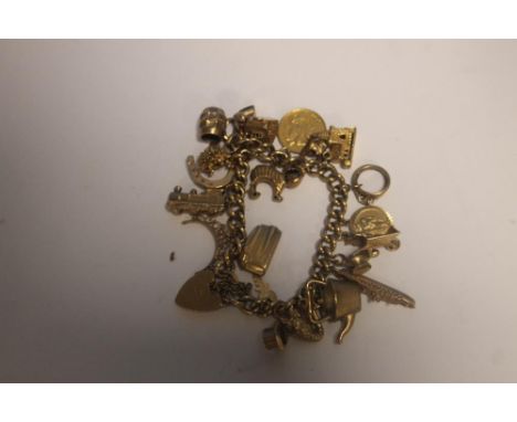 A VINTAGE 9CT GOLD CHARM BRACELET TO INCLUDE A HALF SOVEREIGN CHARM (APPROX WEIGHT 68 GRAM)