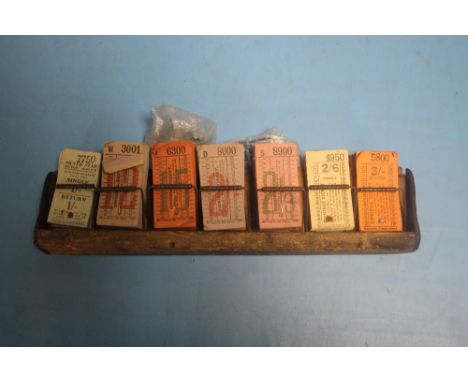 TWO VINTAGE TICKET HOLDERS AND A QUANTITY OF VINTAGE TICKETS