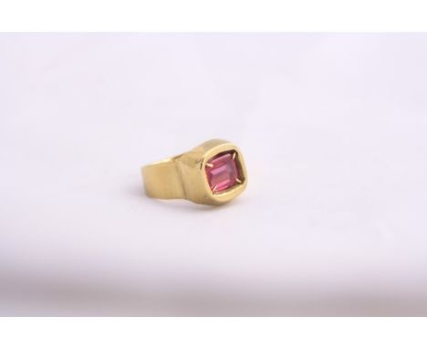 AN 18CT GOLD SYNTHETIC RUBY RING, with large rectangular shape ruby within a raised setting to the plain tapered shank, stamp