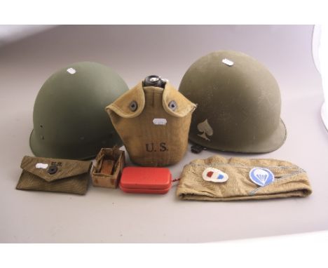 A BOX OF AMERICAN WW2 ERA MILITARIA, to include two army helmets, one x metal, numbered LS-82 on inside, one x plastic?, wate