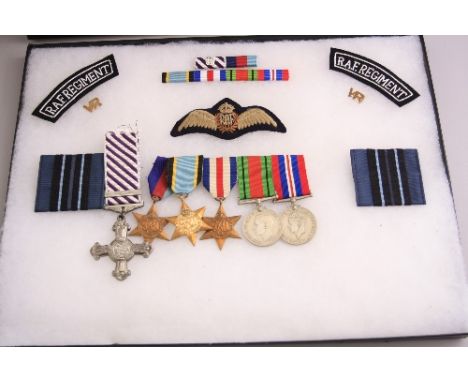 A GLAZED FRAME CONTAINING A WW2 GROUP OF MEDALS, together with a number of RAF patches, ribbon bar, etc, group consists of Di